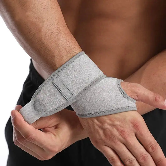 ApexFitness Wrist Brace strapping on demonstration on wrist grey