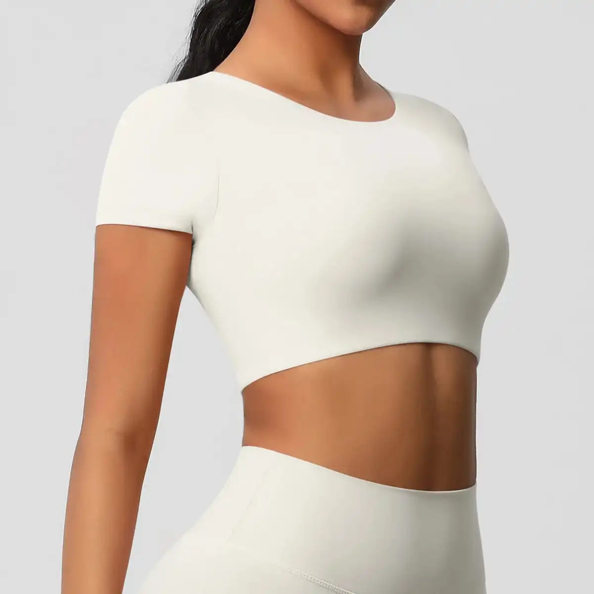Apex Sculpt cropped gym/yoga top light ivory side